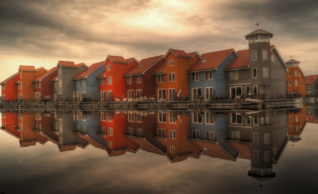 real estate. Buildings reflected on the water.